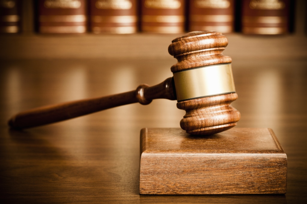 Judge's gavel on a wooden bench